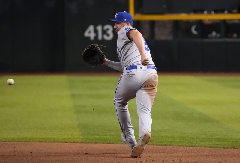 Apr 25, 2023; Phoenix, Arizona, USA; Kansas City Royals first baseman Vinnie Pasquantino (9) fields a ground ball against the Arizona Diamondbacks during the sixth inning at Chase Field. Mandatory Credit: Joe Camporeale-USA TODAY Sports