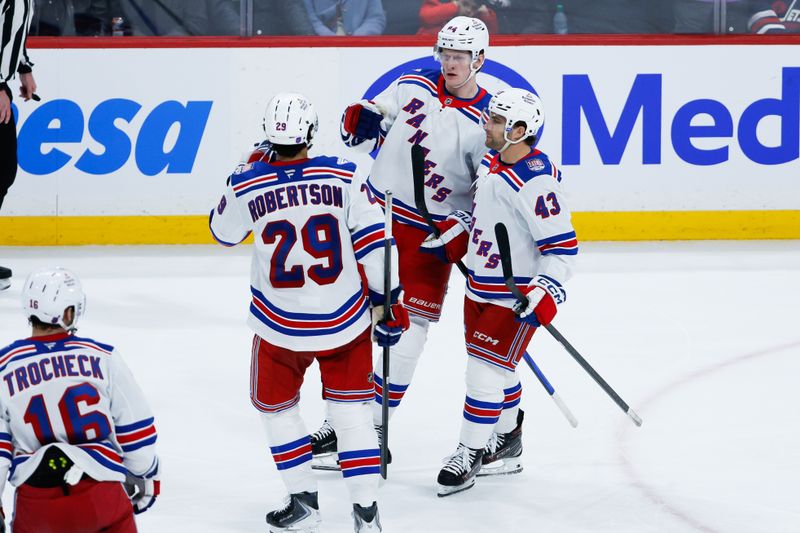 Mar 12, 2026; Winnipeg, Manitoba, CAN; New York Rangers forward Adam Edstrom (84)  is congratulated by his teammates on his goal against the Winnipeg Jets during the third period at Canada Life Centre. Mandatory Credit: Terrence Lee-Imagn Images