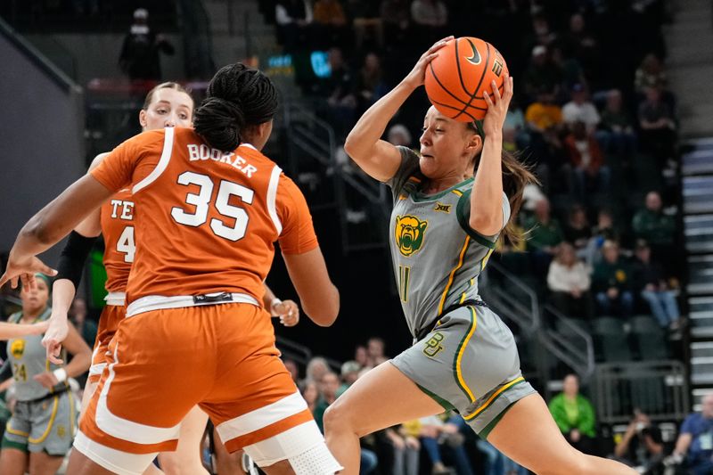 Feb 1, 2024; Waco, Texas, USA; Baylor Lady Bears guard Jada Walker (11) drives to the basket for a lap against Texas Longhorns forward Madison Booker (35) during the first half at Paul and Alejandra Foster Pavilion. Mandatory Credit: Chris Jones-USA TODAY Sports