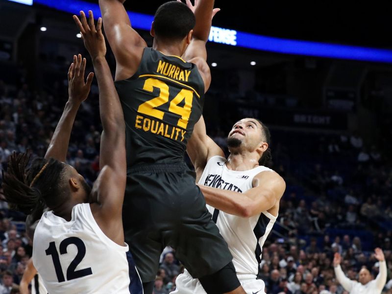 Jan 1, 2023; University Park, Pennsylvania, USA; Iowa Hawkeyes forward Kris Murray (24) grabs for a rebound as Penn State Nittany Lions guard/forward Seth Lundy (1) and guard/forward Evan Mahaffey (12) defend during the second half at Bryce Jordan Center. Penn State defeated Iowa 83-79. Mandatory Credit: Matthew OHaren-USA TODAY Sports