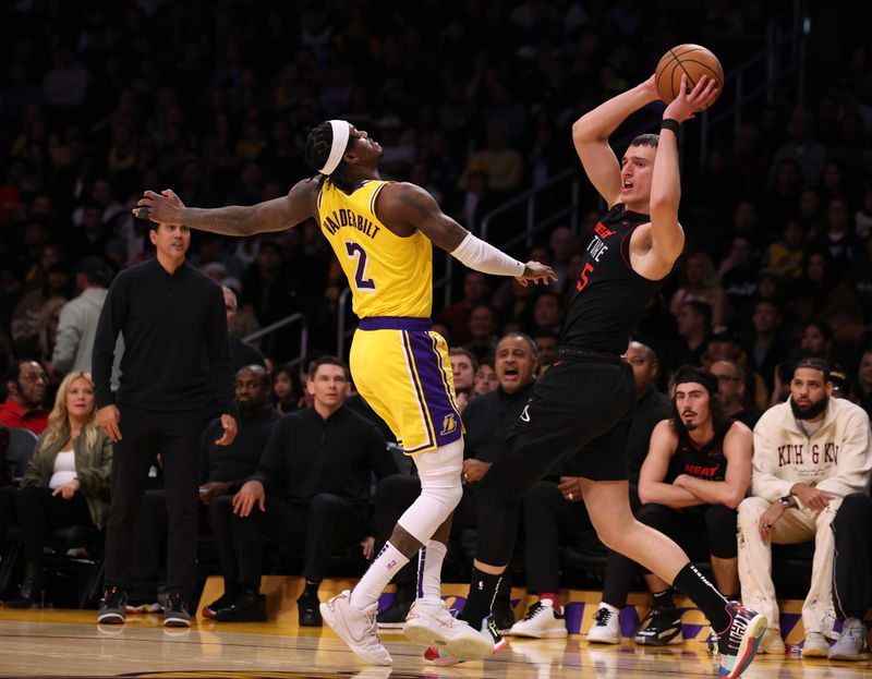 LOS ANGELES, CALIFORNIA - JANUARY 03: Nikola Jovic #5 of the Miami Heat looks to pass in front of Jarred Vanderbilt #2 of the Los Angeles Lakers during a 110-96 Heat win at Crypto.com Arena on January 03, 2024 in Los Angeles, California. (Photo by Harry How/Getty Images)