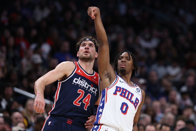 WASHINGTON, DC - FEBRUARY 10: Tyrese Maxey #0 of the Philadelphia 76ers shoots in front of Corey Kispert #24 of the Washington Wizards during the second half at Capital One Arena on February 10, 2024 in Washington, DC. NOTE TO USER: User expressly acknowledges and agrees that, by downloading and or using this photograph, User is consenting to the terms and conditions of the Getty Images License Agreement.  (Photo by Patrick Smith/Getty Images)