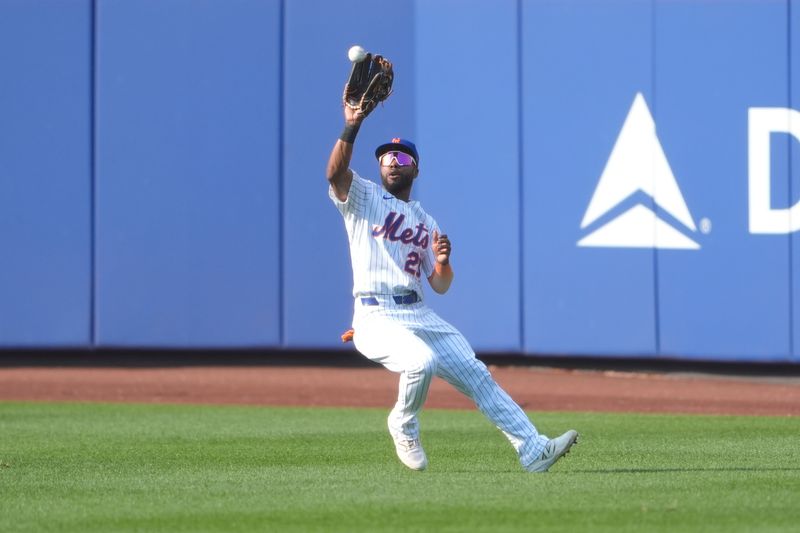 Sep 14, 2025; New York City, New York, USA; New York Mets center fielder Cedric Mullins (28) catches a fly ball hit by Texas Rangers center fielder Wyatt Langford (36) (not pictured) during the tenth inning at Citi Field. Mandatory Credit: Gregory Fisher-Imagn Images