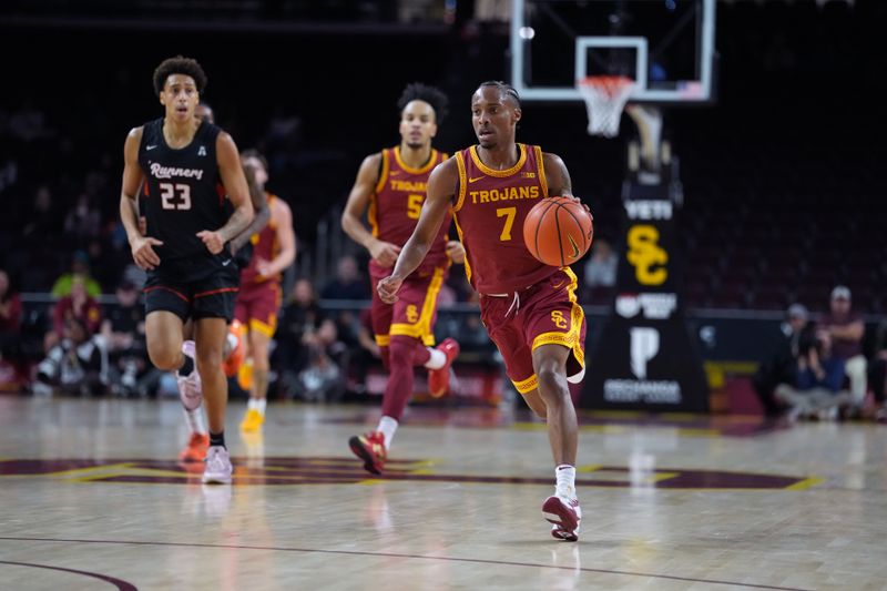 Dec 17, 2025; Los Angeles, California, USA; Southern California Trojans guard Jordan Marsh (7) dribbles the ball against UTSA Roadrunners forward Matheo Coffi (23) in the first half at Galen Center. Mandatory Credit: Kirby Lee-Imagn Images