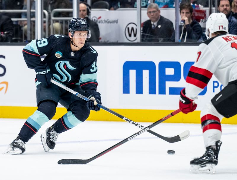 Dec 7, 2023; Seattle, Washington, USA; Seattle Kraken defenseman Vince Dunn (29) skates against New Jersey Devils defenseman Simon Nemec (17) during the second period at Climate Pledge Arena. Mandatory Credit: Stephen Brashear-USA TODAY Sports