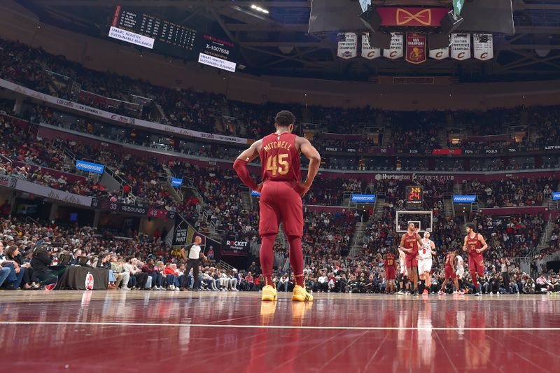 CLEVELAND, OH - FEBRUARY 14: Donovan Mitchell #45 of the Cleveland Cavaliers looks on during the game against the Chicago Bulls on February 14, 2024 at Rocket Mortgage FieldHouse in Cleveland, Ohio. NOTE TO USER: User expressly acknowledges and agrees that, by downloading and/or using this Photograph, user is consenting to the terms and conditions of the Getty Images License Agreement. Mandatory Copyright Notice: Copyright 2024 NBAE (Photo by David Liam Kyle/NBAE via Getty Images)