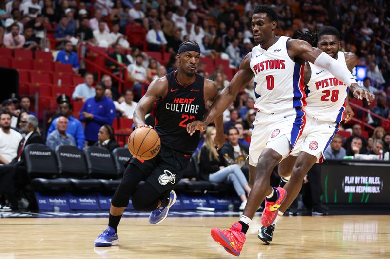 MIAMI, FLORIDA - MARCH 05: Jimmy Butler #22 of the Miami Heat drives against Jalen Duren #0 of the Detroit Pistons during the second quarter of the game at Kaseya Center on March 05, 2024 in Miami, Florida. NOTE TO USER: User expressly acknowledges and agrees that, by downloading and or using this photograph, User is consenting to the terms and conditions of the Getty Images License Agreement. (Photo by Megan Briggs/Getty Images)