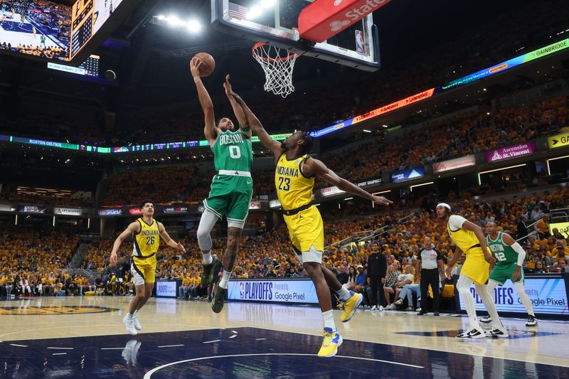 INDIANAPOLIS, INDIANA - MAY 25: Jayson Tatum #0 of the Boston Celtics shoots the ball against Aaron Nesmith #23 of the Indiana Pacers during the first quarter in Game Three of the Eastern Conference Finals at Gainbridge Fieldhouse on May 25, 2024 in Indianapolis, Indiana. NOTE TO USER: User expressly acknowledges and agrees that, by downloading and or using this photograph, User is consenting to the terms and conditions of the Getty Images License Agreement. (Photo by Stacy Revere/Getty Images)