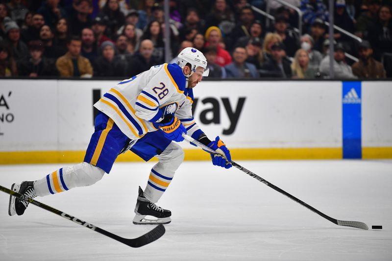 Feb 13, 2023; Los Angeles, California, USA; Buffalo Sabres left wing Zemgus Girgensons (28) moves the puck against the Los Angeles Kings during the second period at Crypto.com Arena. Mandatory Credit: Gary A. Vasquez-USA TODAY Sports