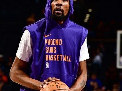 PHOENIX, AZ - DECEMBER 12: Kevin Durant #35 of the Phoenix Suns warms up before the game against the Golden State Warriors on December 12, 2023 at Footprint Center in Phoenix, Arizona. NOTE TO USER: User expressly acknowledges and agrees that, by downloading and or using this photograph, user is consenting to the terms and conditions of the Getty Images License Agreement. Mandatory Copyright Notice: Copyright 2023 NBAE (Photo by Barry Gossage/NBAE via Getty Images)