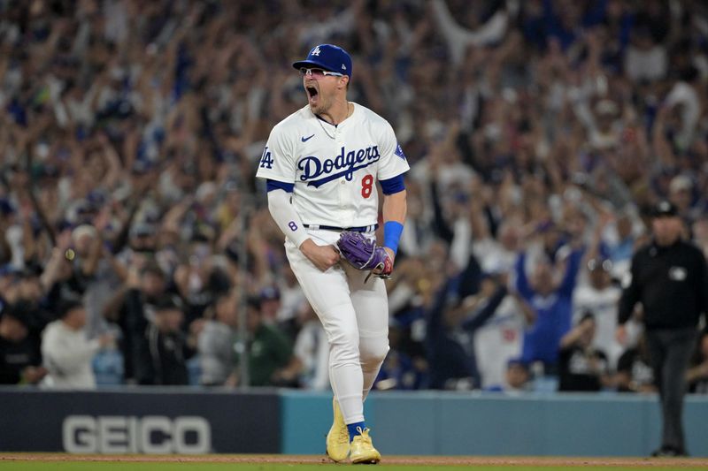 Oct 11, 2024; Los Angeles, California, USA; Los Angeles Dodgers third baseman Enrique Hernandez (8) celebrates after defeating the San Diego Padres during game five of the NLDS for the 2024 MLB Playoffs at Dodger Stadium. Mandatory Credit: Jayne Kamin-Oncea-Imagn Images