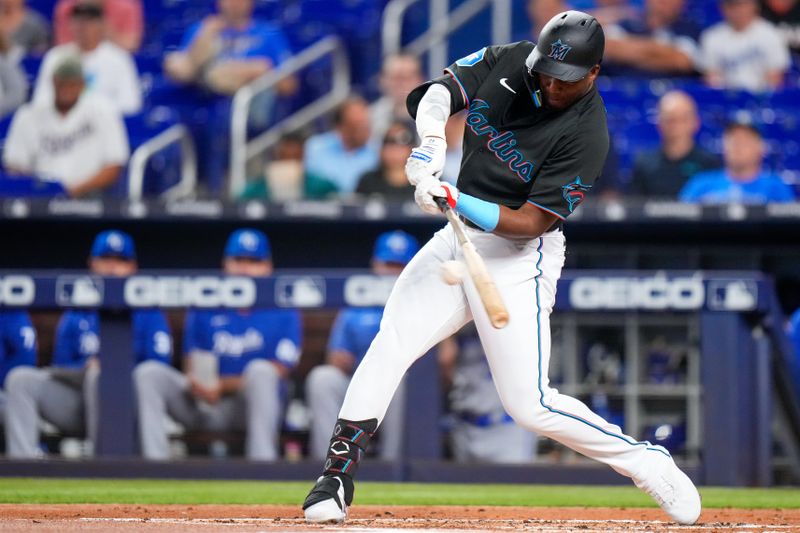 Jun 7, 2023; Miami, Florida, USA; Miami Marlins right fielder Jesus Sanchez (7) hits a single against the Kansas City Royals during the first inning at loanDepot Park. Mandatory Credit: Rich Storry-USA TODAY Sports