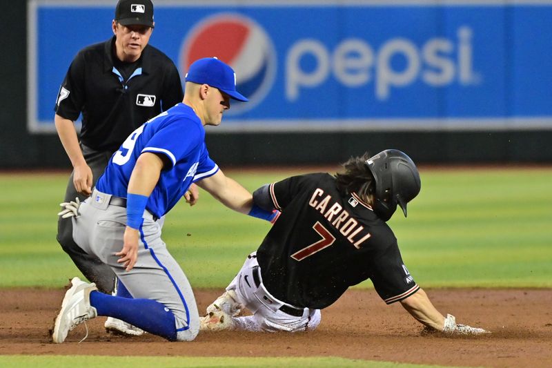 Apr 26, 2023; Phoenix, Arizona, USA; Arizona Diamondbacks left fielder Corbin Carroll (7) is out by Kansas City Royals second baseman Michael Massey (19) in the second inning at Chase Field. Mandatory Credit: Matt Kartozian-USA TODAY Sports