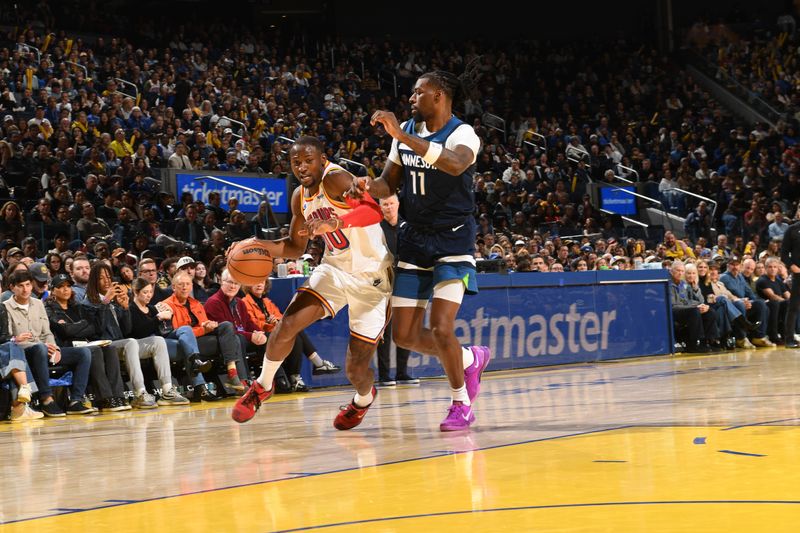 SAN FRANCISCO, CA - DECEMBER 8:  Jonathan Kuminga #00 of the Golden State Warriors drives to the basket during the game against the Minnesota Timberwolves during a regular season game on December 8, 2024 at Chase Center in San Francisco, California. NOTE TO USER: User expressly acknowledges and agrees that, by downloading and or using this photograph, user is consenting to the terms and conditions of Getty Images License Agreement. Mandatory Copyright Notice: Copyright 2024 NBAE (Photo by Noah Graham/NBAE via Getty Images)