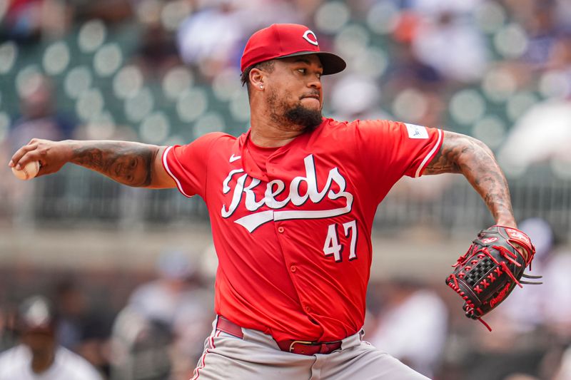 Jul 24, 2024; Cumberland, Georgia, USA; Cincinnati Reds starting pitcher Frankie Montas (47) pitches against the Atlanta Braves during the fifth inning at Truist Park. Mandatory Credit: Dale Zanine-USA TODAY Sports