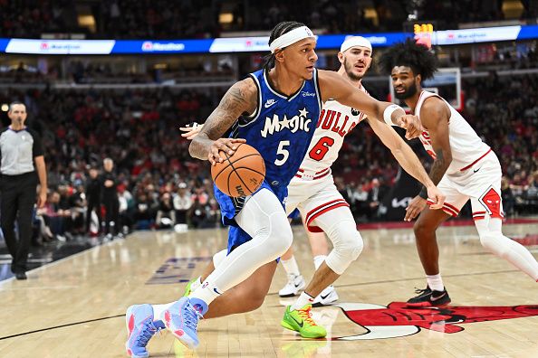 CHICAGO, ILLINOIS - NOVEMBER 15:  Paolo Banchero #5 of the Orlando Magic controls the ball against the Chicago Bulls on November 15, 2023 at United Center in Chicago, Illinois.   NOTE TO USER: User expressly acknowledges and agrees that, by downloading and or using this photograph, User is consenting to the terms and conditions of the Getty Images License Agreement.  (Photo by Jamie Sabau/Getty Images)