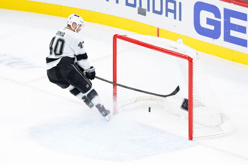 Oct 26, 2025; Chicago, Illinois, USA; Los Angeles Kings right wing Joel Armia (40) scores against the Chicago Blackhawks on the empty-net as he breaks his stick during the third period at United Center. Mandatory Credit: Kamil Krzaczynski-Imagn Images