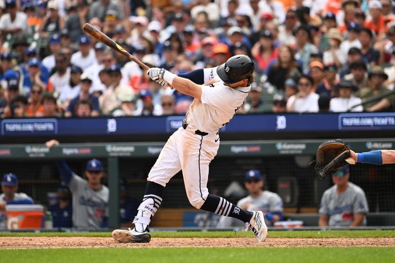 Jul 14, 2024; Detroit, Michigan, USA;  Detroit Tigers shortstop Zach McKinstry (39) hits a lead off triple against the Los Angeles Dodgers in the ninth inning at Comerica Park. Mandatory Credit: Lon Horwedel-USA TODAY Sports