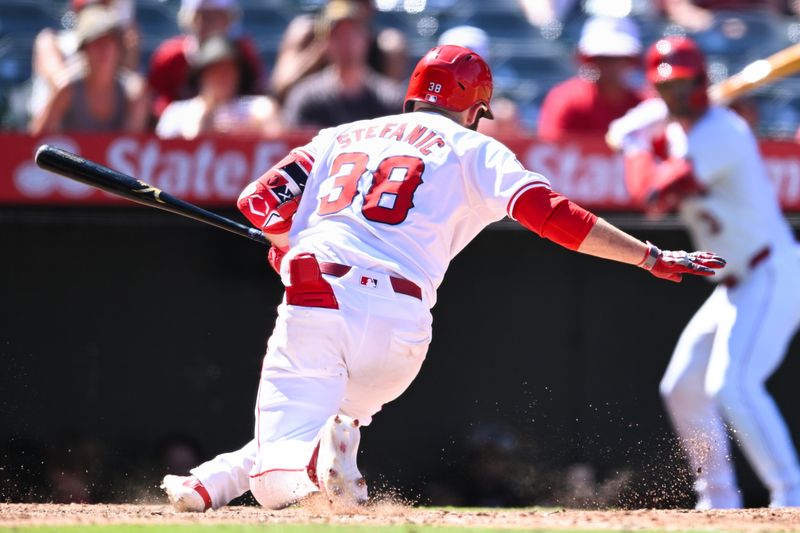 Aug 18, 2024; Anaheim, California, USA; Los Angeles Angels second baseman Michael Stefanic (38) is hit by the ball against the Atlanta Braves during the eighth inning at Angel Stadium. Mandatory Credit: Jonathan Hui-USA TODAY Sports