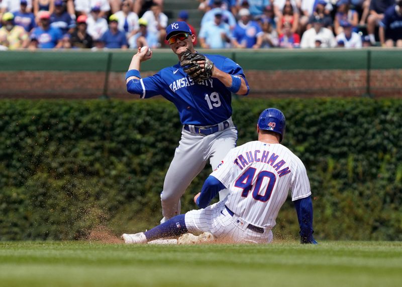 Aug 19, 2023; Chicago, Illinois, USA; Kansas City Royals second baseman Michael Massey (19) forces out Chicago Cubs center fielder Mike Tauchman (40) at second base during the second inning at Wrigley Field. Mandatory Credit: David Banks-USA TODAY Sports