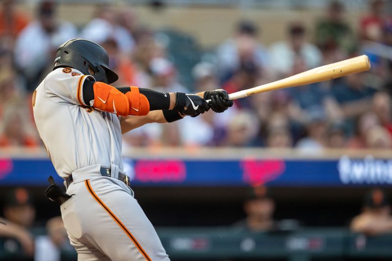 May 23, 2023; Minneapolis, Minnesota, USA; San Francisco Giants right fielder Michael Conforto (8) hits a double in the sixth inning against the Minnesota Twins at Target Field. Mandatory Credit: Jesse Johnson-USA TODAY Sports