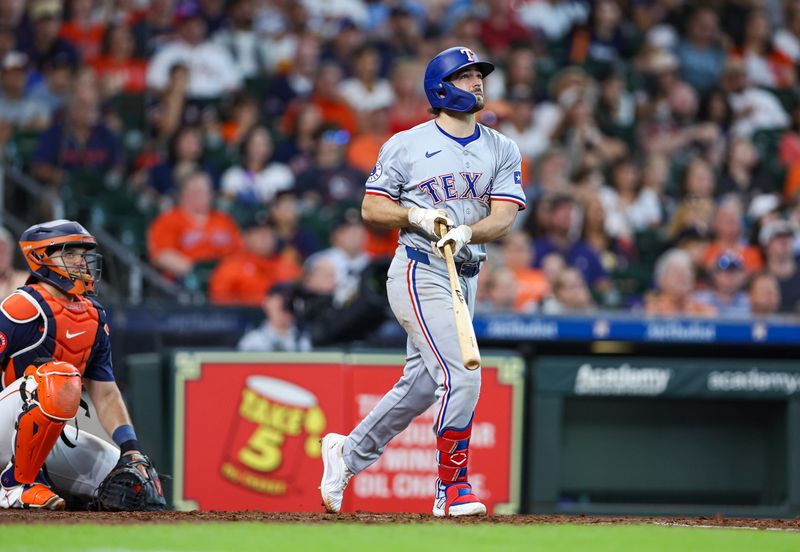 Jul 14, 2024; Houston, Texas, USA; Texas Rangers third baseman Josh Smith (8) hits his second two-run home run of the game during the eighth inning against the Houston Astros at Minute Maid Park. Mandatory Credit: Troy Taormina-USA TODAY Sports