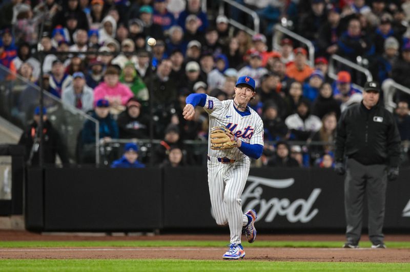 Apr 21, 2025; New York City, New York, USA; New York Mets second baseman Brett Baty (7) fields a ground ball hit by Philadelphia Phillies outfielder Johan Rojas (not pictured) and throws to first base for an out during the third inning at Citi Field. Mandatory Credit: John Jones-Imagn Images
