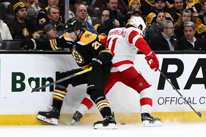 Dec 3, 2024; Boston, Massachusetts, USA; Boston Bruins defenseman Brandon Carlo (25) and Detroit Red Wings right wing Vladimir Tarasenko (11) battle for the puck during the second period at the TD Garden. Mandatory Credit: Brian Fluharty-Imagn Images