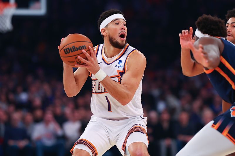 NEW YORK, NY - NOVEMBER 26:  Devin Booker #1 of the Phoenix Suns looks for a pass during the first quarter of the game against the New York Knicks at Madison Square Garden on November 26, 2023 in New York City, New York.  NOTE TO USER: User expressly acknowledges and agrees that, by downloading and or using this photograph, User is consenting to the terms and conditions of the Getty Images License Agreement. (Photo by Rich Graessle/Getty Images)