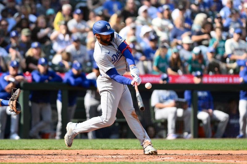 Sep 17, 2023; Seattle, Washington, USA; Los Angeles Dodgers shortstop Amed Rosario (31) hits a single against the Seattle Mariners during the sixth inning at T-Mobile Park. Mandatory Credit: Steven Bisig-USA TODAY Sports