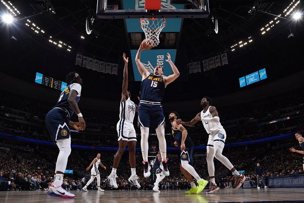 DENVER, CO - DECEMBER 28: Nikola Jokic #15 of the Denver Nuggets grabs a rebound during the game against the Memphis Grizzlies on December 28, 2023 at the Ball Arena in Denver, Colorado. NOTE TO USER: User expressly acknowledges and agrees that, by downloading and/or using this Photograph, user is consenting to the terms and conditions of the Getty Images License Agreement. Mandatory Copyright Notice: Copyright 2023 NBAE (Photo by Garrett Ellwood/NBAE via Getty Images)