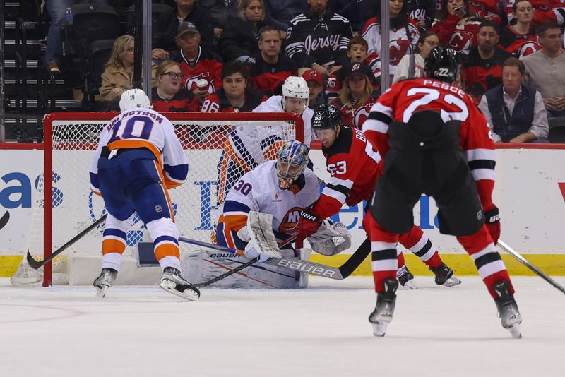 Oct 25, 2024; Newark, New Jersey, USA; New York Islanders goaltender Ilya Sorokin (30) makes a save on New Jersey Devils left wing Jesper Bratt (63) during the third period at Prudential Center. Mandatory Credit: Ed Mulholland-Imagn Images