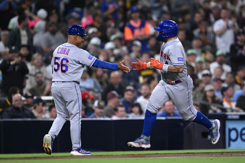 Jul 8, 2023; San Diego, California, USA; New York Mets catcher Francisco Alvarez (4) is congratulated by third base coach Joey Cora (56) after hitting a home run against the San Diego Padres during the seventh inning at Petco Park. Mandatory Credit: Orlando Ramirez-USA TODAY Sports