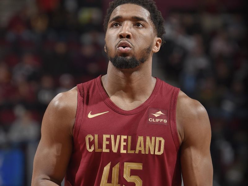 CLEVELAND, OH - JANUARY 31: Donovan Mitchell #45 of the Cleveland Cavaliers shoots a free throw during the game against the Detroit Pistons on January 31, 2024 at Rocket Mortgage FieldHouse in Cleveland, Ohio. NOTE TO USER: User expressly acknowledges and agrees that, by downloading and/or using this Photograph, user is consenting to the terms and conditions of the Getty Images License Agreement. Mandatory Copyright Notice: Copyright 2024 NBAE (Photo by David Liam Kyle/NBAE via Getty Images)