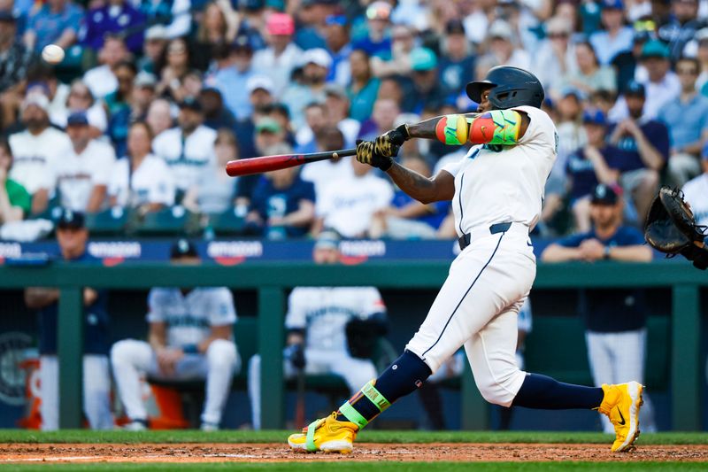 Jun 30, 2025; Seattle, Washington, USA; Seattle Mariners left fielder Randy Arozarena (56) hits a three-run home run against the Kansas City Royals during the fifth inning at T-Mobile Park. Mandatory Credit: Joe Nicholson-Imagn Images