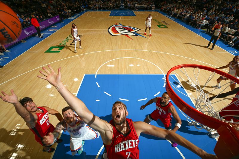 OKLAHOMA CITY, OK - OCTOBER 9: Jock Landale #2 of the Houston Rockets grabs the rebound during the game against the Oklahoma City Thunder during a NBA pre season game on October 9, 2024 at Paycom Center in Oklahoma City, Oklahoma. NOTE TO USER: User expressly acknowledges and agrees that, by downloading and or using this photograph, User is consenting to the terms and conditions of the Getty Images License Agreement. Mandatory Copyright Notice: Copyright 2024 NBAE (Photo by Zach Beeker/NBAE via Getty Images)