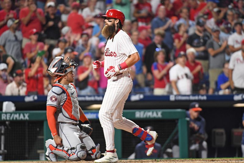 Aug 26, 2024; Philadelphia, Pennsylvania, USA; Philadelphia Phillies outfielder Brandon Marsh (16) steps on home after hitting a home run against the Houston Astros during the fifth inning at Citizens Bank Park. Mandatory Credit: Eric Hartline-USA TODAY Sports