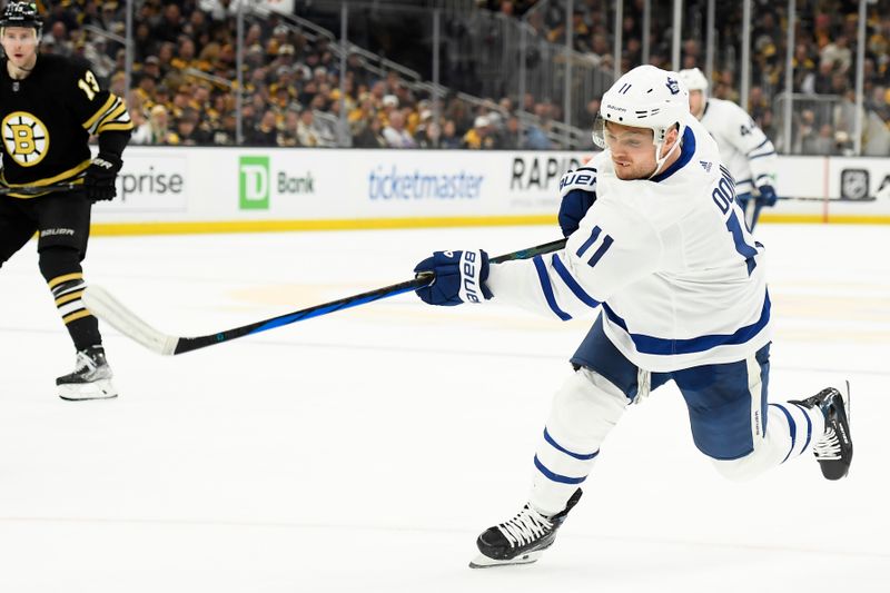 Apr 20, 2024; Boston, Massachusetts, USA; Toronto Maple Leafs center Max Domi (11) shoots the puck during the second period in game one of the first round of the 2024 Stanley Cup Playoffs against the Boston Bruins at TD Garden. Mandatory Credit: Bob DeChiara-USA TODAY Sports