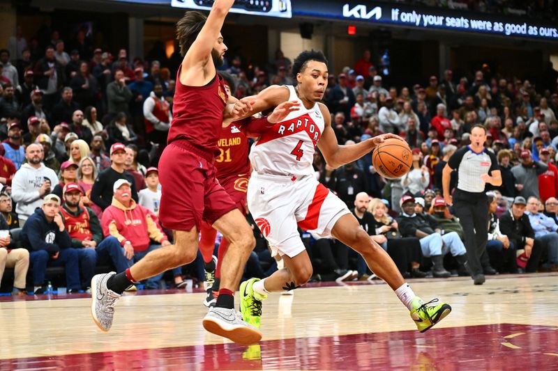 CLEVELAND, OHIO - JANUARY 09: Scottie Barnes #4 of the Toronto Raptors drives to the basket around Max Strus #1 of the Cleveland Cavaliers during the fourth quarter at Rocket Mortgage Fieldhouse on January 09, 2025 in Cleveland, Ohio. The Cavaliers defeated the Raptors 132-126. NOTE TO USER: User expressly acknowledges and agrees that, by downloading and or using this photograph, User is consenting to the terms and conditions of the Getty Images License Agreement. (Photo by Jason Miller/Getty Images)