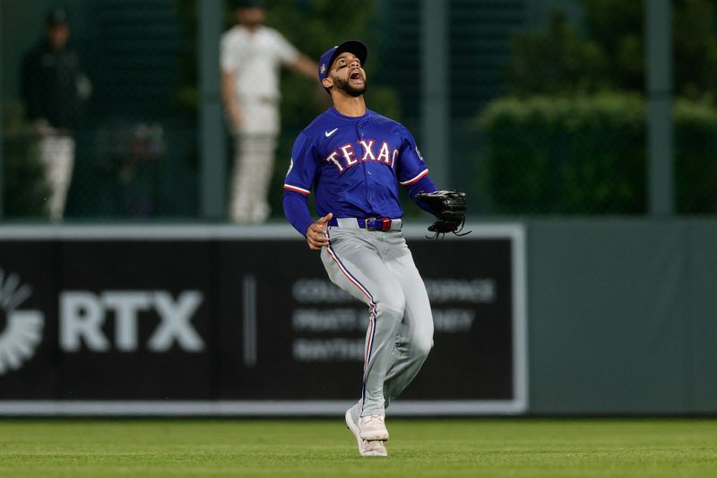 May 10, 2024; Denver, Colorado, USA; Texas Rangers center fielder Leody Taveras (3) calls for the ball in the seventh inning against the Colorado Rockies at Coors Field. Mandatory Credit: Isaiah J. Downing-USA TODAY Sports