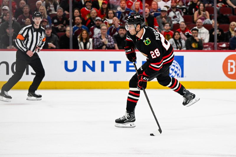Mar 20, 2026; Chicago, Illinois, USA;  Chicago Blackhawks left wing Andre Burakovsky (28) shoots the puck against the Colorado Avalanche during the first period at United Center. Mandatory Credit: Matt Marton-Imagn Images