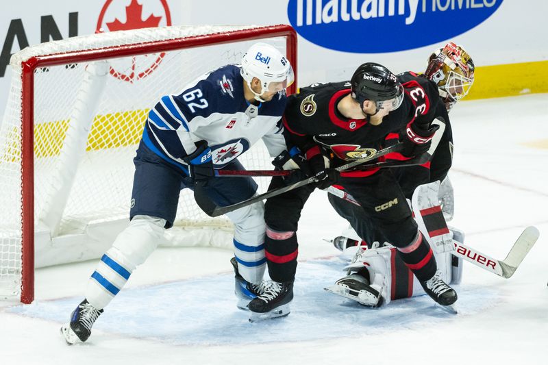 Feb 26, 2025; Ottawa, Ontario, CAN; Winnipeg Jets right wing Nino Niederreiter (62) battles with Ottawa Senators defenseman Nikolas Matinpalo (33) in front of goalie Linus Ullmark (35) in the third period at the Canadian Tire Centre. Mandatory Credit: Marc DesRosiers-Imagn Images