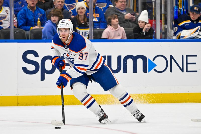 Feb 15, 2024; St. Louis, Missouri, USA;  Edmonton Oilers center Connor McDavid (97) controls the puck against the St. Louis Blues during the first period at Enterprise Center. Mandatory Credit: Jeff Curry-USA TODAY Sports