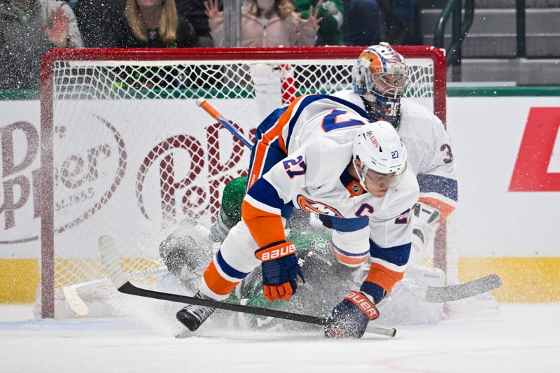 Feb 26, 2024; Dallas, Texas, USA; New York Islanders left wing Anders Lee (27) and Dallas Stars center Joe Pavelski (16) crash into Islanders goaltender Ilya Sorokin (30) during the third period at the American Airlines Center. Mandatory Credit: Jerome Miron-USA TODAY Sports