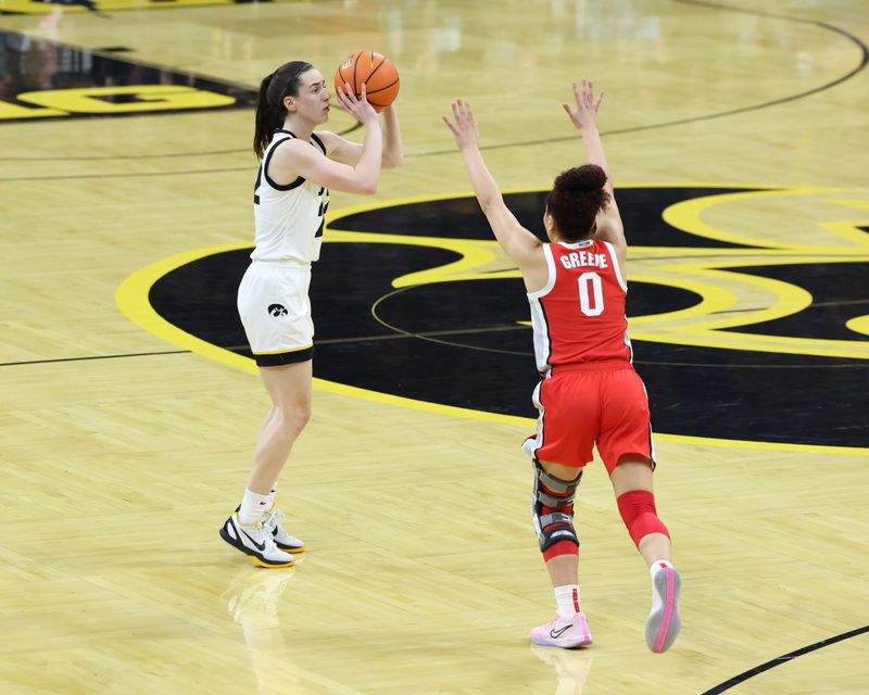 Mar 3, 2024; Iowa City, Iowa, USA; Ohio State Buckeyes guard Madison Greene (0) defends the shot from Iowa Hawkeyes guard Caitlin Clark (22) during the first half at Carver-Hawkeye Arena. Mandatory Credit: Reese Strickland-USA TODAY Sports