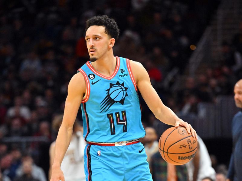 CLEVELAND, OHIO - JANUARY 04: Landry Shamet #14 of the Phoenix Suns brings the ball up court during the second half against the Cleveland Cavaliers at Rocket Mortgage Fieldhouse on January 04, 2023 in Cleveland, Ohio. The Cavaliers defeated 90-88. NOTE TO USER: User expressly acknowledges and agrees that, by downloading and or using this photograph, User is consenting to the terms and conditions of the Getty Images License Agreement. (Photo by Jason Miller/Getty Images)