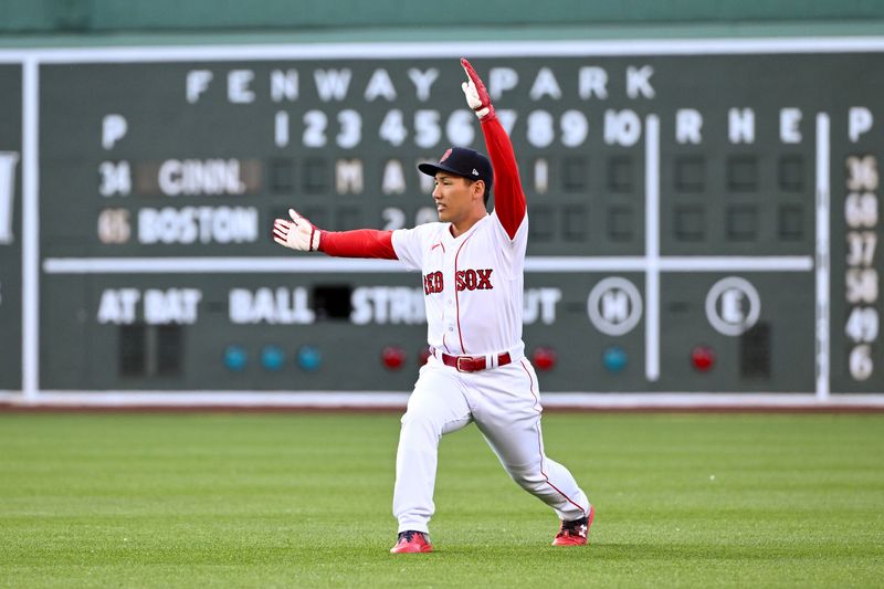 May 31, 2023; Boston, Massachusetts, USA; Boston Red Sox left fielder Masataka Yoshida (7) stretches before a game against the Cincinnati Reds at Fenway Park. Mandatory Credit: Brian Fluharty-USA TODAY Sports