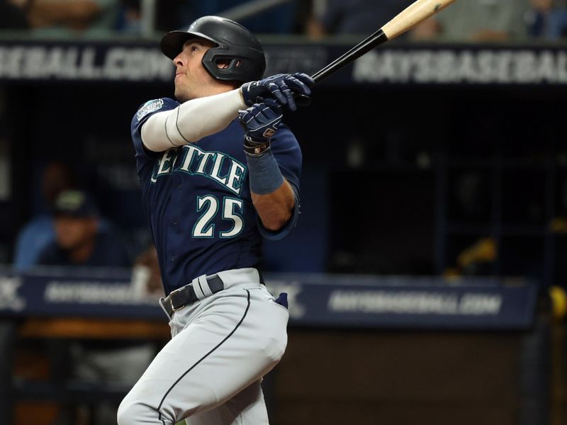 Sep 8, 2023; St. Petersburg, Florida, USA; Seattle Mariners left fielder Dylan Moore (25) hits a RBI double against the Tampa Bay Rays during the second inning at Tropicana Field. Mandatory Credit: Kim Klement Neitzel-USA TODAY Sports