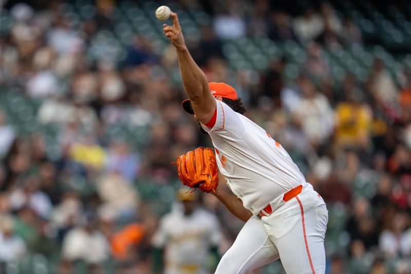 Jul 30, 2024; San Francisco, California, USA;  San Francisco Giants starting pitcher Robbie Ray (23) delivers a pitch against the Oakland Athletics during the first inning at Oracle Park. Mandatory Credit: Neville E. Guard-USA TODAY Sports