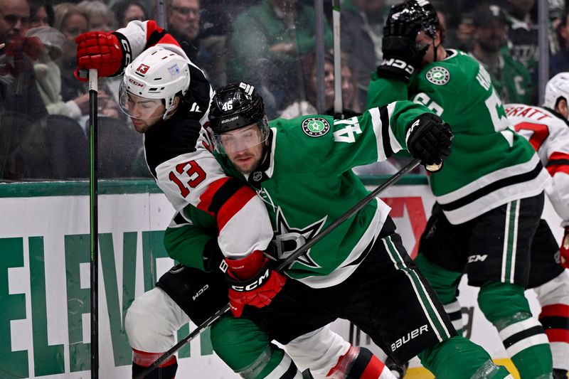 Mar 4, 2025; Dallas, Texas, USA; Dallas Stars defenseman Ilya Lyubushkin (46) checks New Jersey Devils center Nico Hischier (13) during the first period at the American Airlines Center. Mandatory Credit: Jerome Miron-Imagn Images
